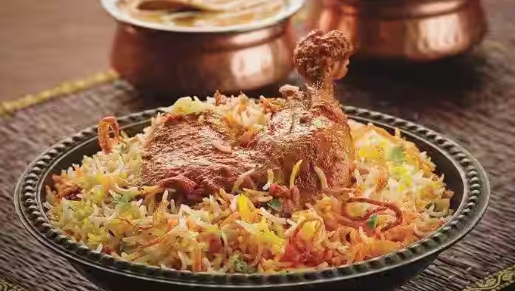 Authentic Hyderabadi Biryani in a handi from Hyderabad Biryani Hotel, Malleshwaram West, for Best Biryani in Bangalore.