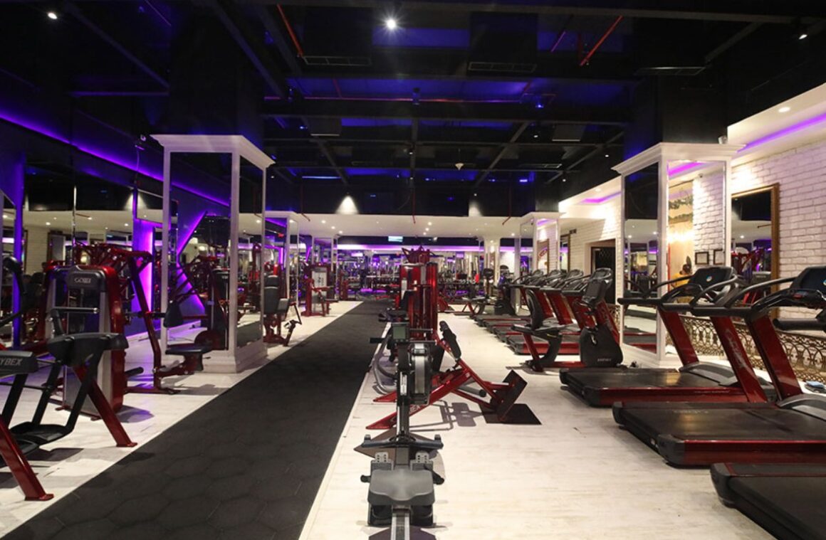 Luxury gym interior with DJ booth and premium equipment at Nitro Bespoke Fitness Mumbai