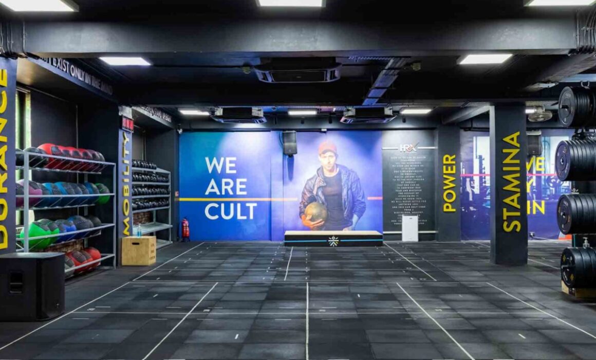Group workout session at a Cult.fit center in India showing functional fitness and HRX training