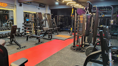 Gym interior with weights and equipment in Koramangala