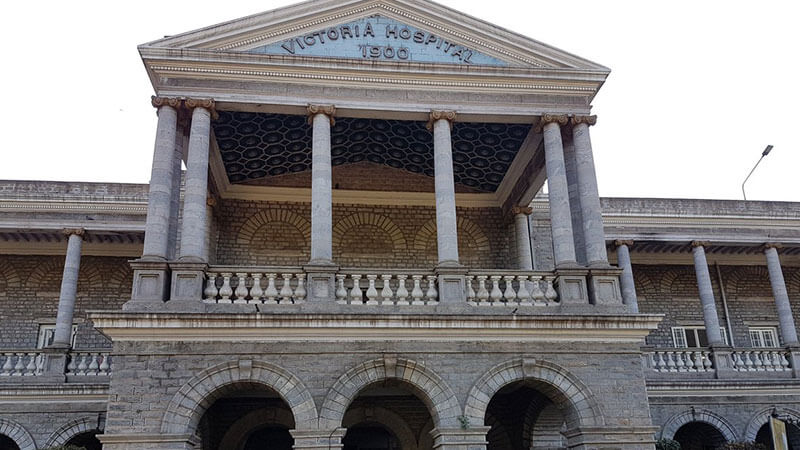The colonial-era Victoria Hospital entrance (1900), one of the old and spooky Haunted Places in Bangalore with a food-stealing ghost.