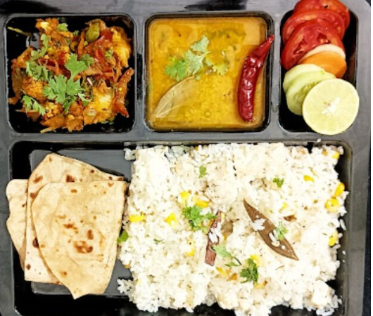 A stack of freshly charred naan bread, demonstrating the quality of home-style Indian options from Bangalore tiffin providers.